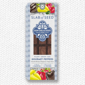 Packaged gourmet peppers with 'Slab of Seed' branding on a textured white background