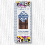Load image into Gallery viewer, Packaged salad flowers with decorative elements on a textured white background
