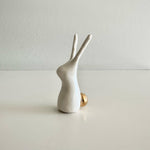 Load image into Gallery viewer, White ceramic rabbit figurine on a light gray surface with a white background
