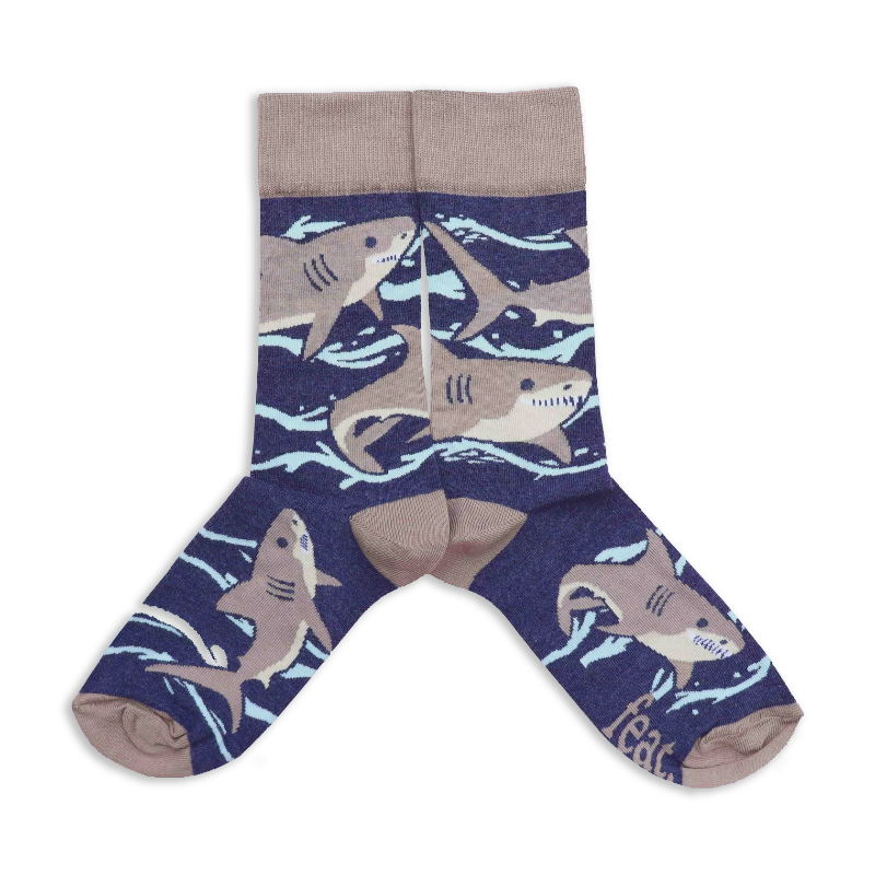 A pair of socks with a blue background featuring great white shark illustrations.