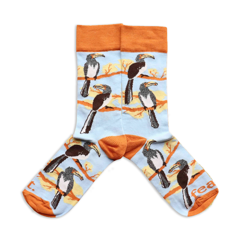A pair of socks with a light blue background featuring hornbill bird illustrations.