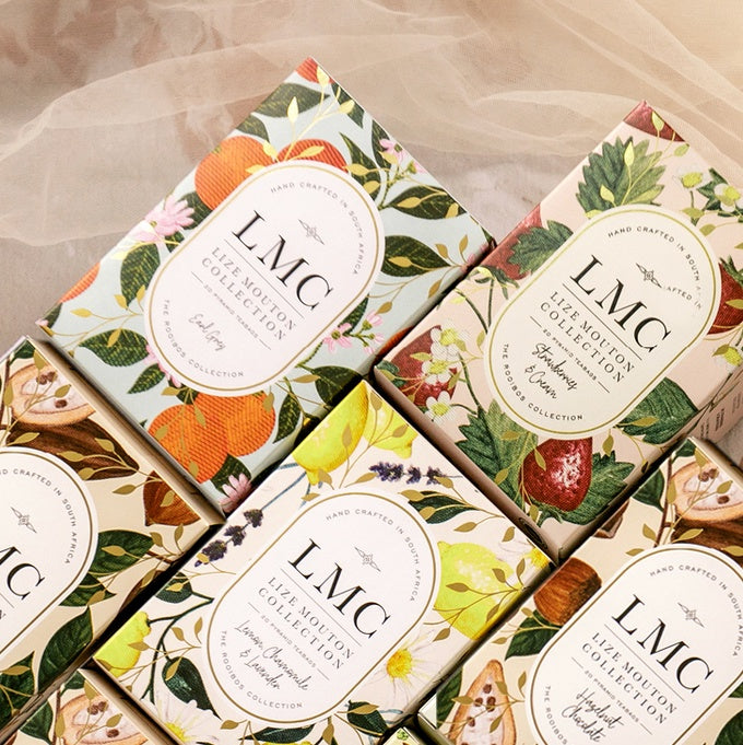 LMC tea rooibos tins with fruit and leaf designs on packaging