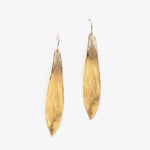 Load image into Gallery viewer, Pair of bronze leaf-shaped earrings on a white background
