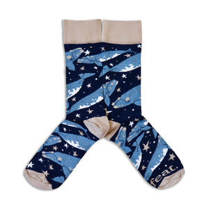 Sock with whale and star pattern on a white background