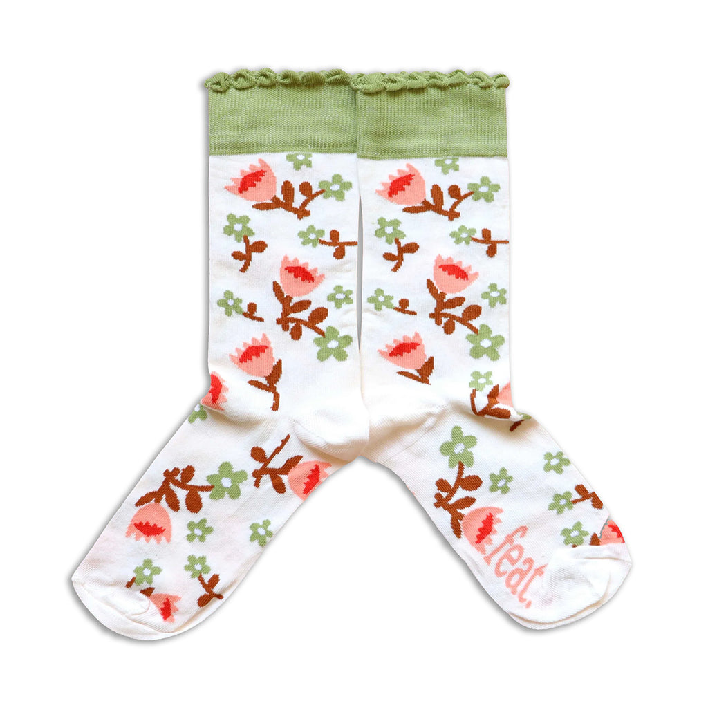 Floral-patterned socks with green top on a white background