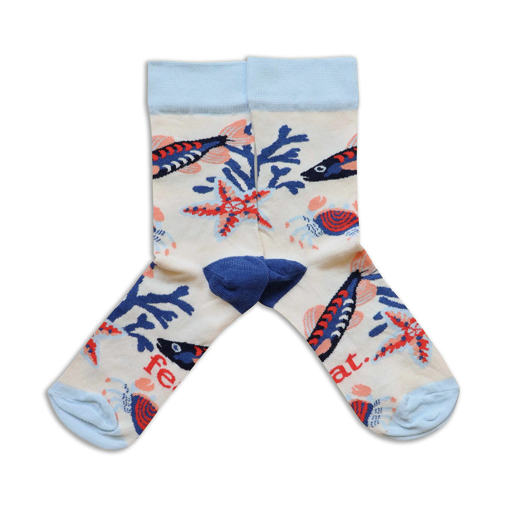 Pair of socks with fish and coral design on a white background