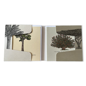 Two greeting cards with tree illustrations on a white background