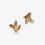 Load image into Gallery viewer, Bronze flower earrings on a white background
