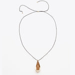 Load image into Gallery viewer, Necklace with a teardrop-shaped pendant on a white background
