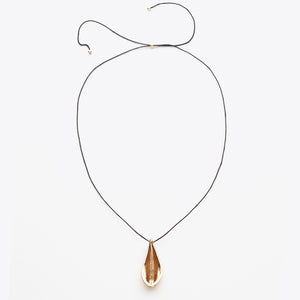 Necklace with a teardrop-shaped pendant on a white background