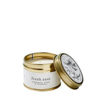 Load image into Gallery viewer, Candle in a gold tin with &#39;fresh zest&#39; label on a white background
