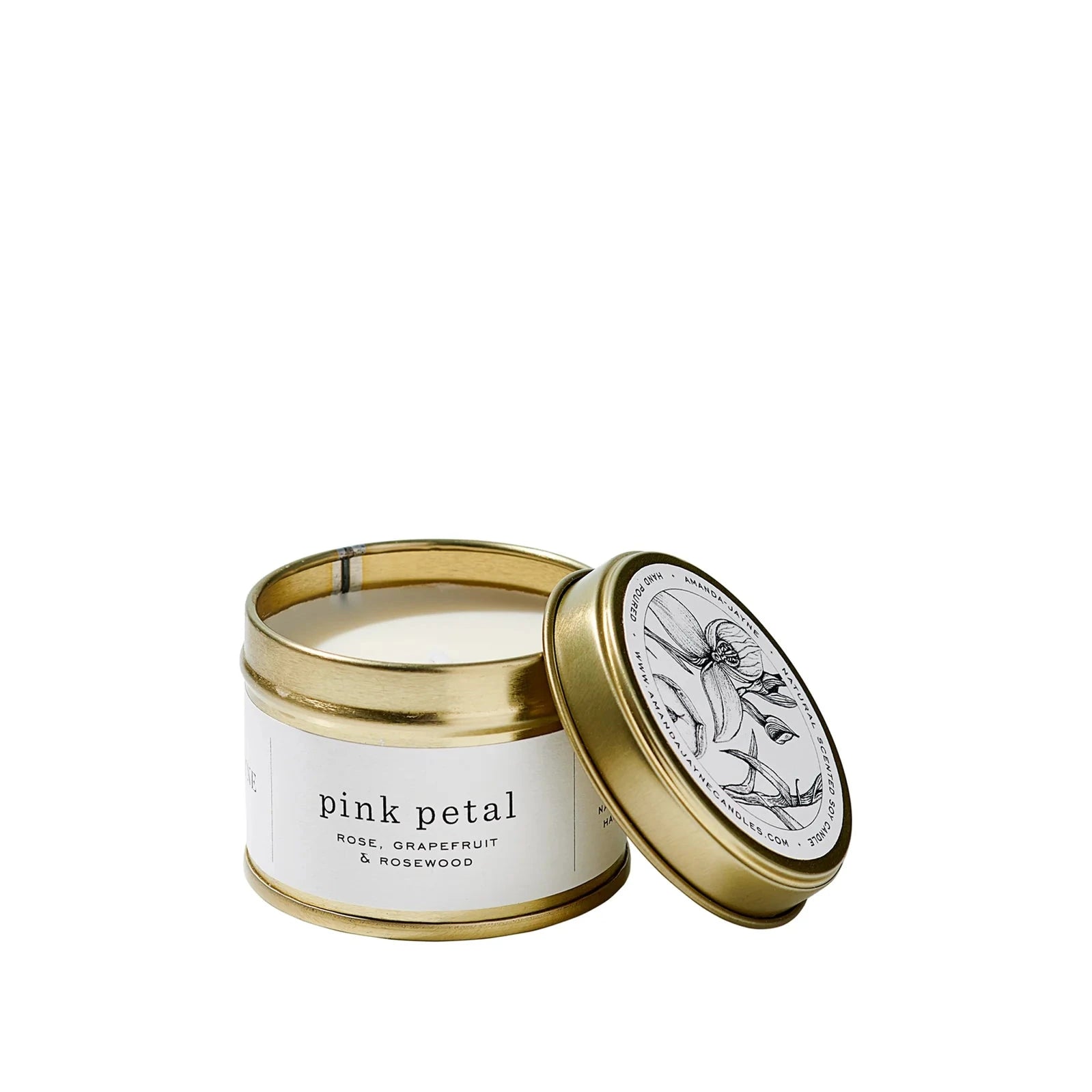 Candle in a gold tin with a white label on a white background