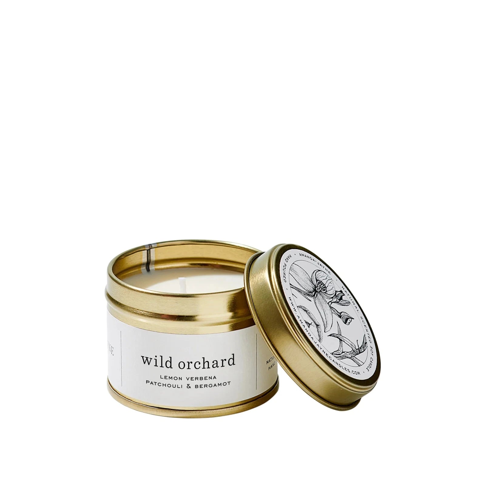 Candle in a gold tin with a white label on a white background