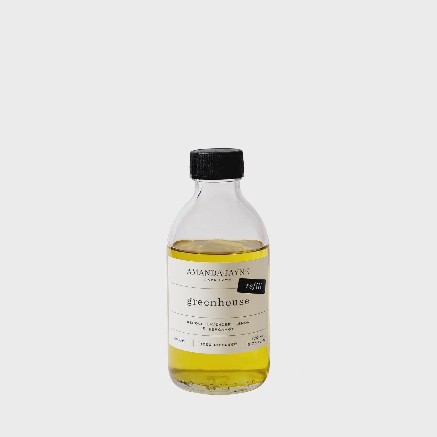 Bottle of Amanda Jayne 'Greenhouse' product on a white background