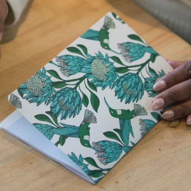 Notebook with a floral design on a table