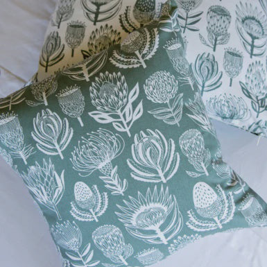 Floral patterned fabric with white flowers on a green background