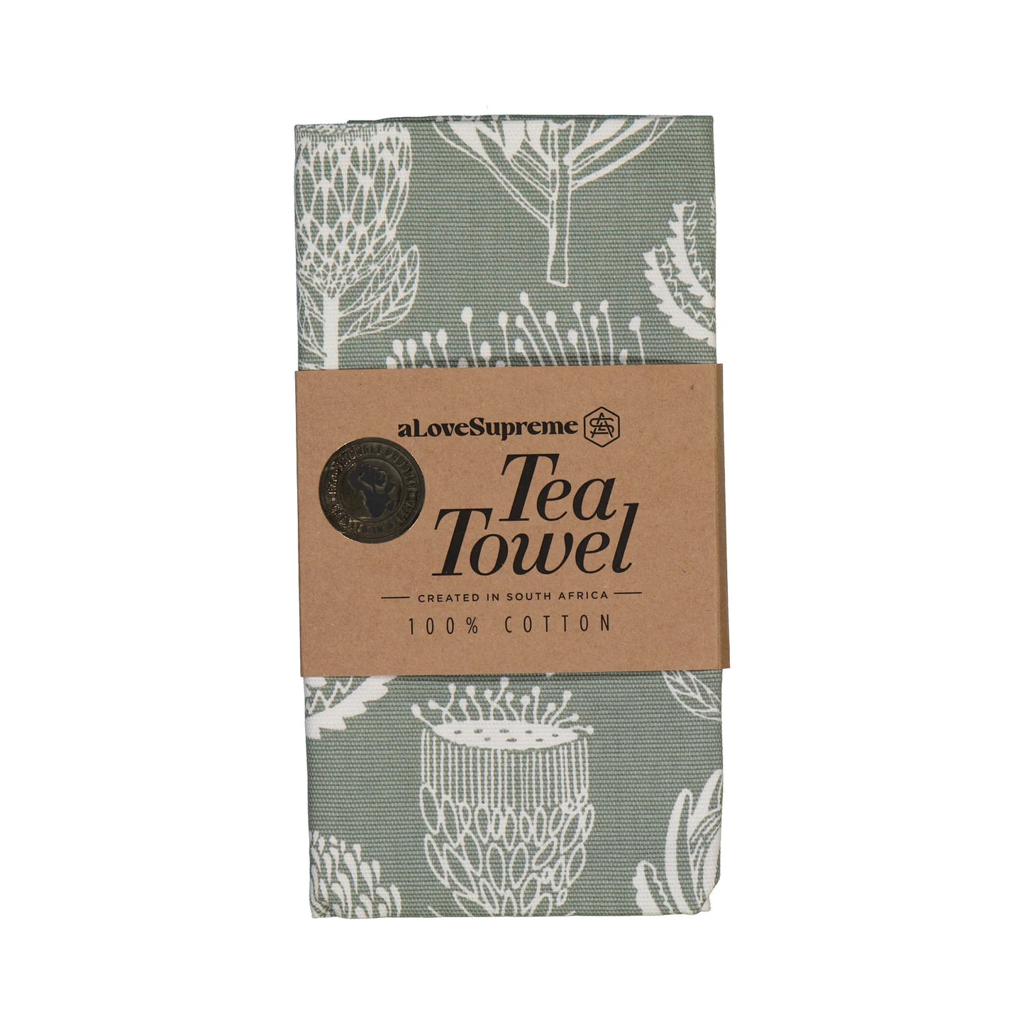 Tea towel with floral pattern and cardboard packaging on a white background