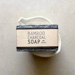 Load image into Gallery viewer, Bar of bamboo charcoal soap with a white background
