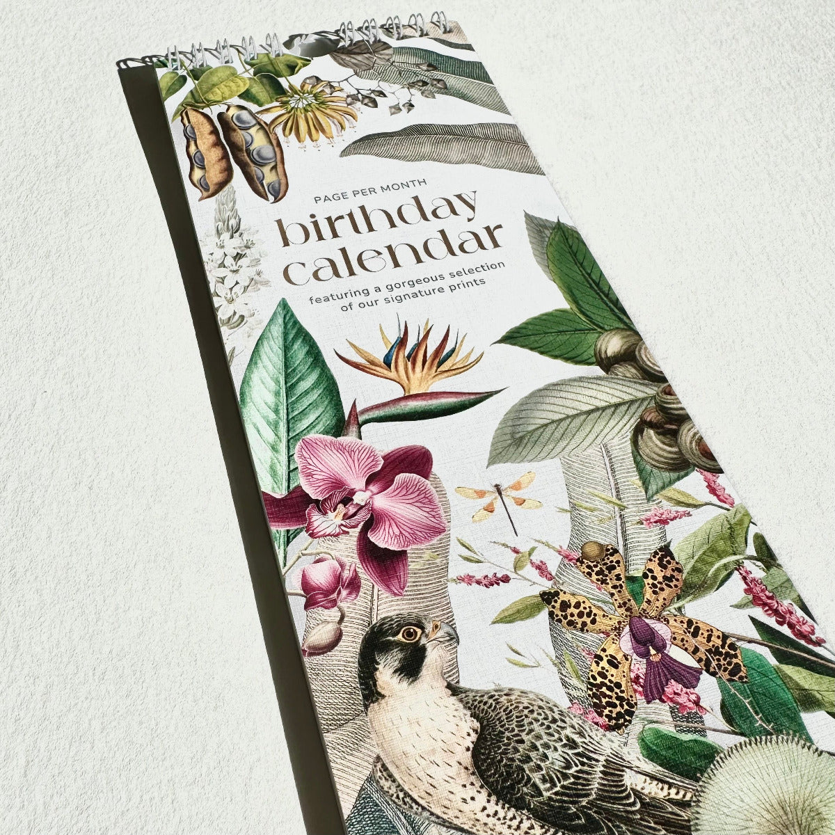 Birthday calendar with botanical and animal illustrations on a white background