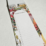 Load image into Gallery viewer, Floral-patterned notepad with a calendar on a light gray background
