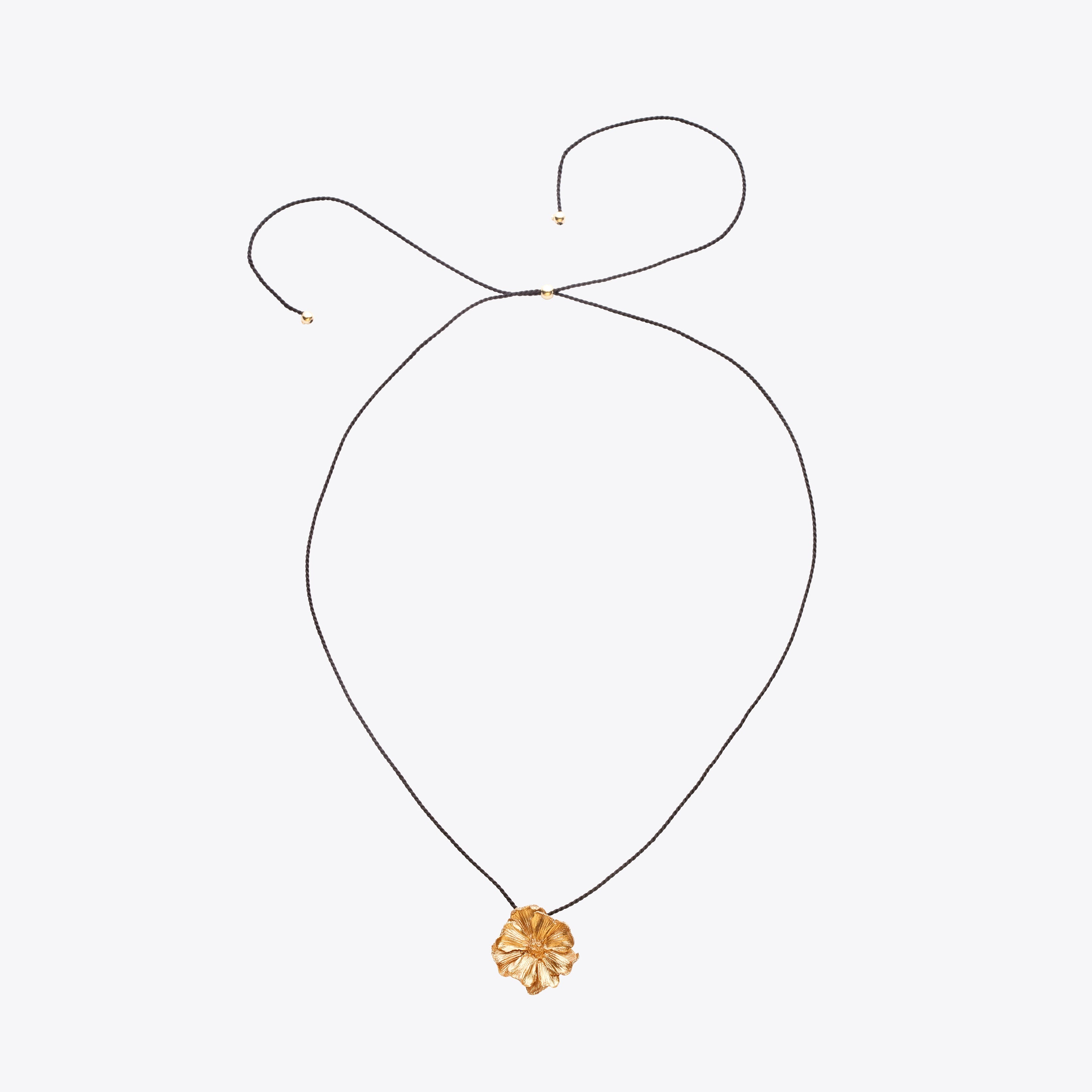 Bronze necklace with a floral pendant on a white background
