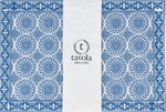 Load image into Gallery viewer, Blue and white patterned placemat with &#39;tavola&#39; branding on a white background.

