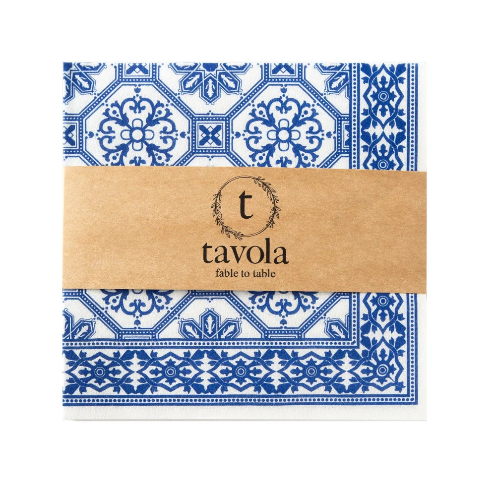Packaged napkins with blue and white pattern and 'tavola' branding on a white background
