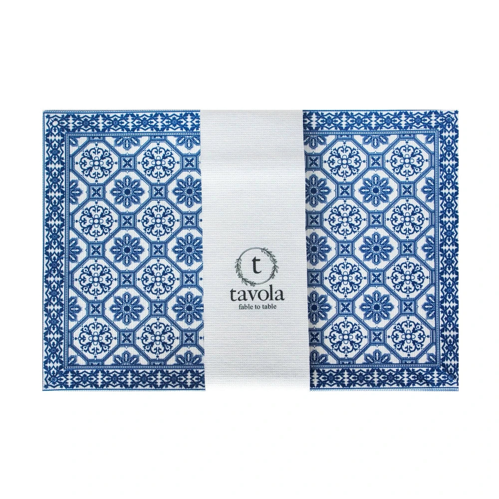 Blue patterned placemat with 'tavola' branding on a white background
