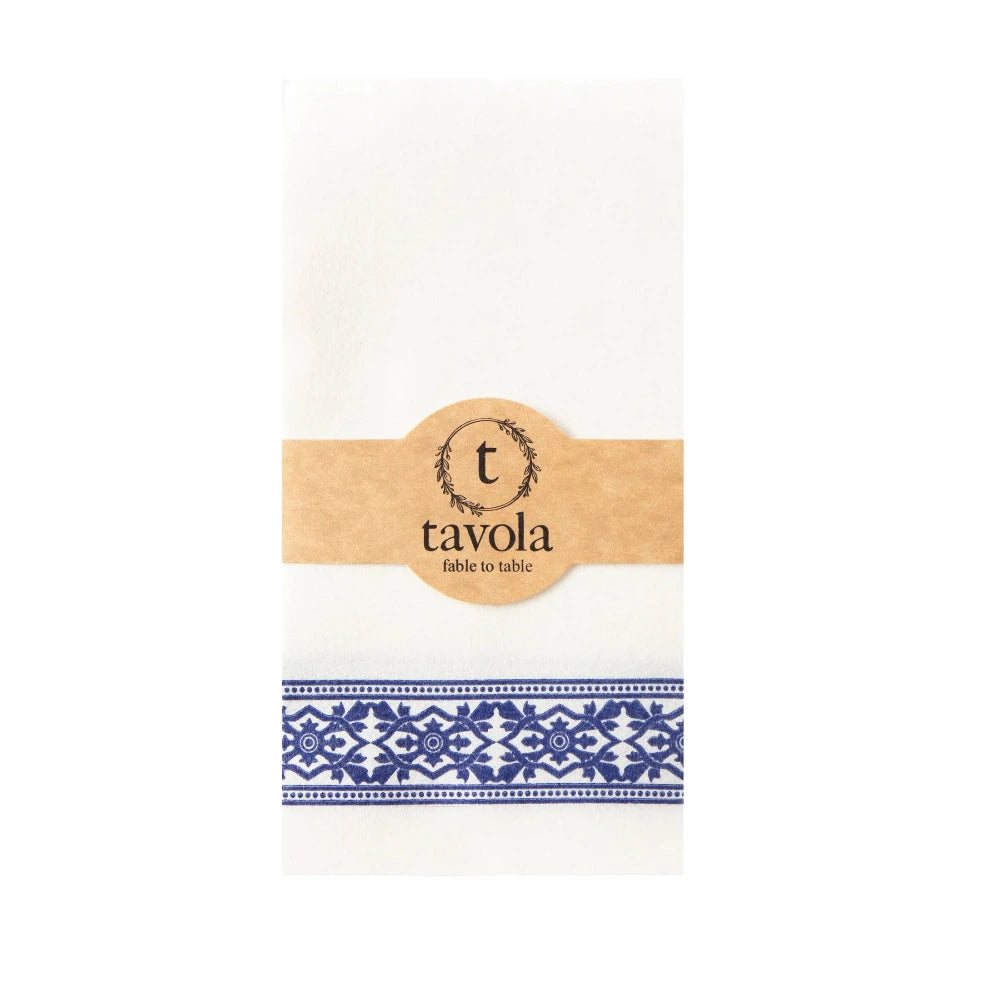 White napkin with blue pattern and 'tavola' branding on a white background