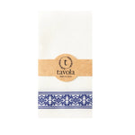 Load image into Gallery viewer, White napkin with blue pattern and &#39;tavola&#39; branding on a white background
