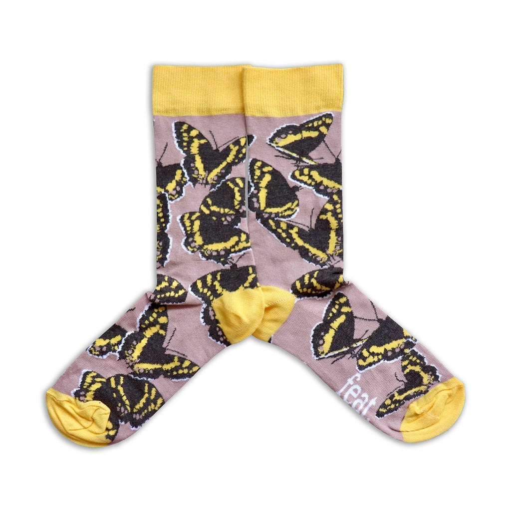 Socks with butterfly pattern and yellow accents on a white background