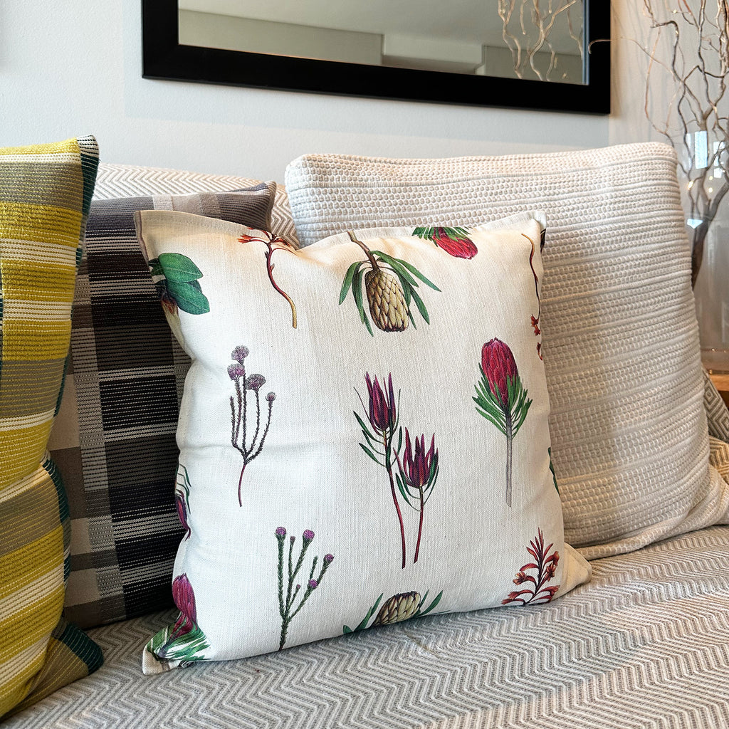 Decorative pillow with fynbos floral pattern on a sofa