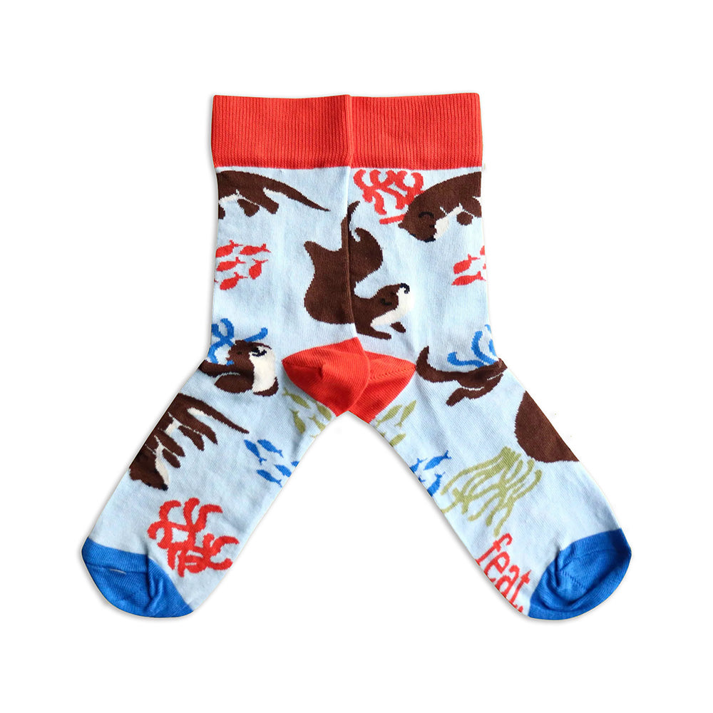Colorful socks with otter pattern on a white background
