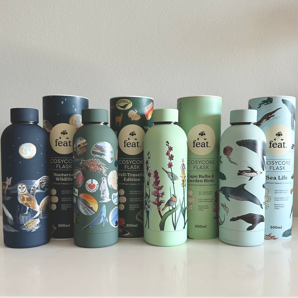 A collection of CosyCore flasks with various designs, displayed in a row, featuring animals and botanical illustrations.