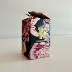 Load image into Gallery viewer, Floral packaging box for honey nougat with a bee design on a white background
