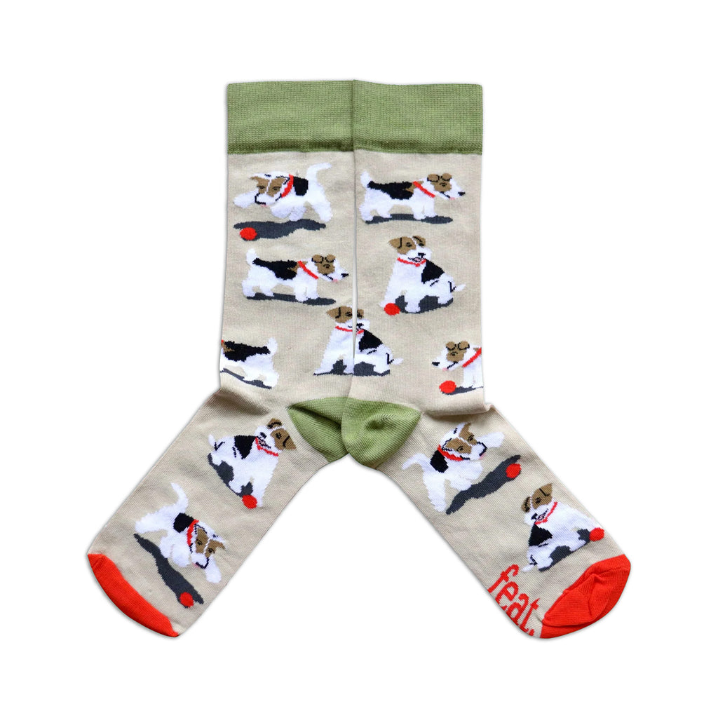 Beige socks with dog illustrations on a white background