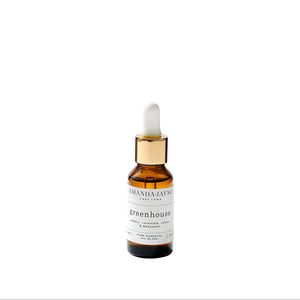Amber glass dropper bottle with gold cap on a white background