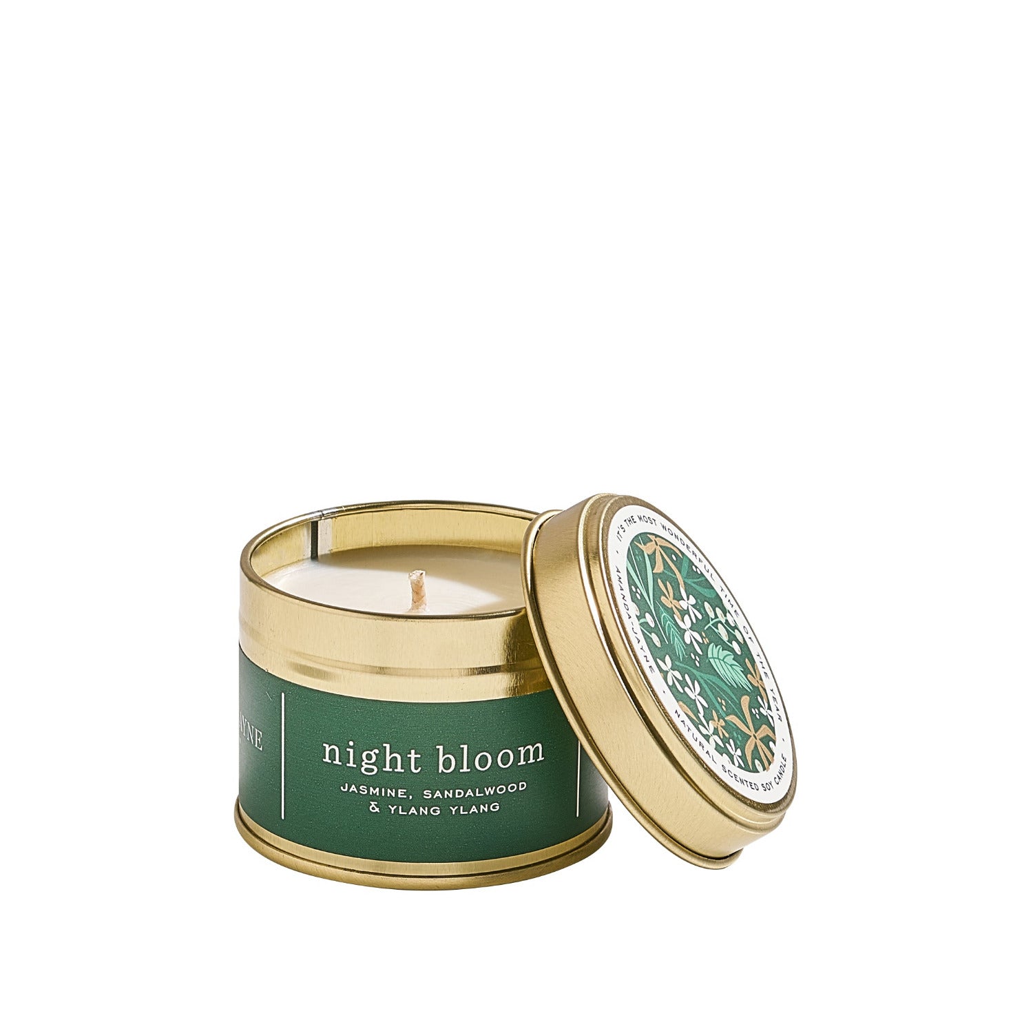 Travel candle in a gold tin with gold lid labeled 'night bloom' on a white background