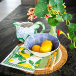 Load image into Gallery viewer, Decorative setting with a bowl of lemons, teapot, and floral arrangement on a dark surface.
