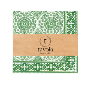 Packaging of Tavola napkins with green geometric patterns on a white background
