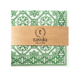 Green and white patterned napkin with a brown band featuring 'tavola' branding on a white background.