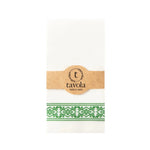 Load image into Gallery viewer, White napkin with green pattern and brown label with &#39;tavola&#39; branding on a white background
