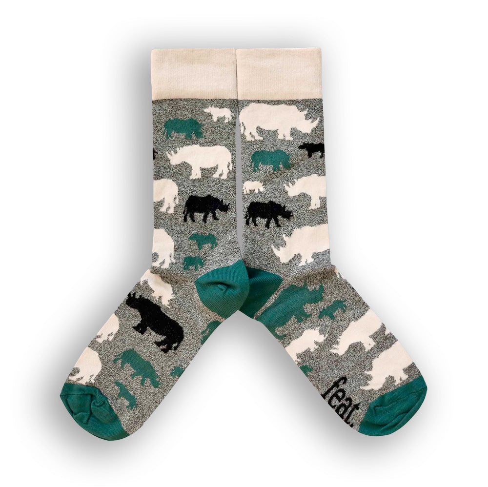 A pair of socks with a speckled grey and forest green pattern, featuring black and green rhino illustrations and the word 'FEAT' on the green toe area.