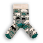 Load image into Gallery viewer, A pair of socks with a speckled grey and forest green pattern, featuring black and green rhino illustrations and the word &#39;FEAT&#39; on the green toe area.
