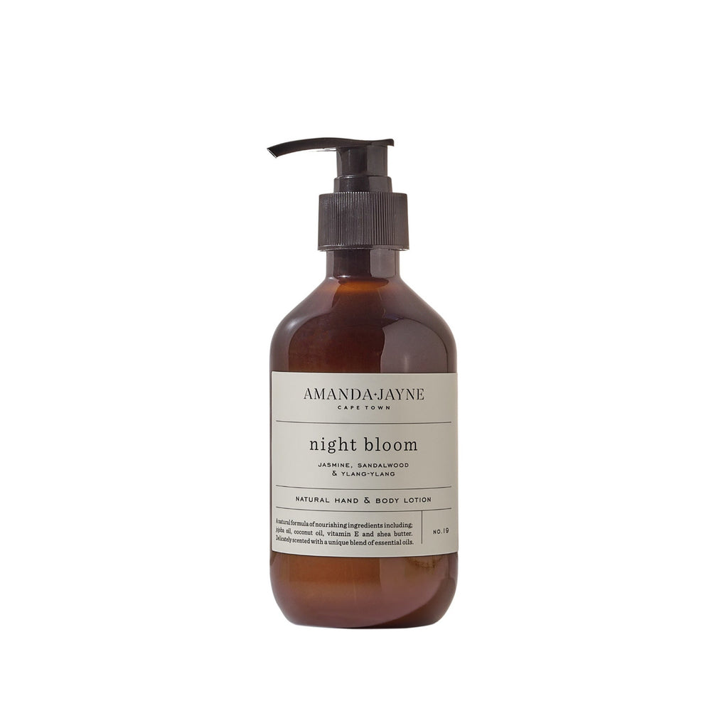 Amber bottle of Amanda Jayne 'Night Bloom' lotion on a white background