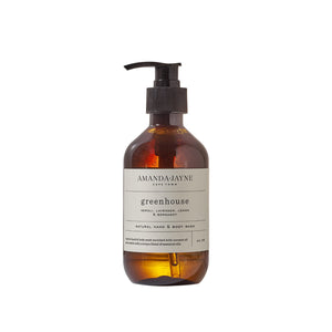 A bottle of Amanda Jayne Greenhouse hand and body wash on a white background