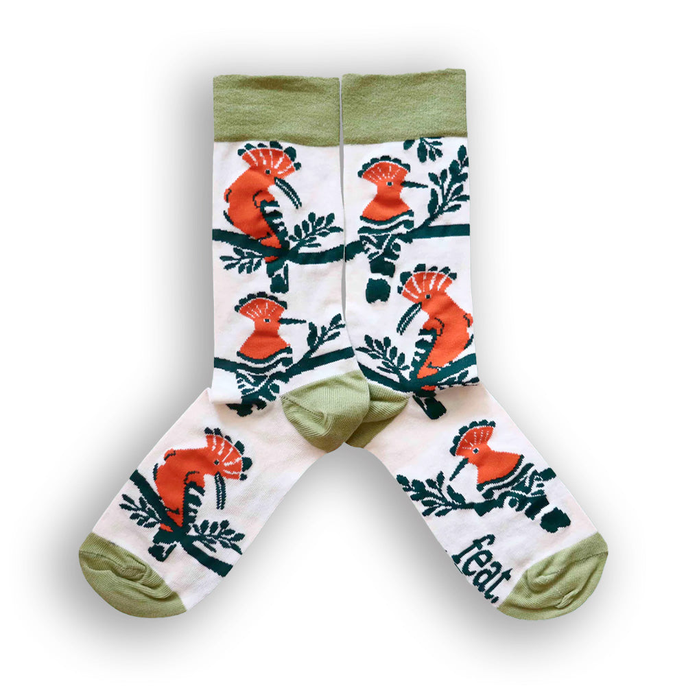 Cream and green cotton socks with orange and green hoopoe birds patterns and the word 'FEAT' on the toe area.