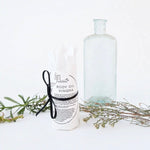 Load image into Gallery viewer, A wrapped bottle filled body oil, labeled &#39;BODY OIL KINGNA&#39;,
