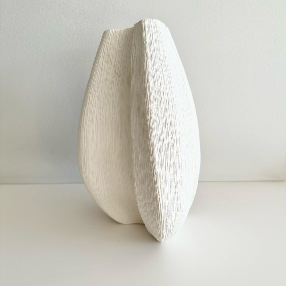 White ceramic vase on a white background