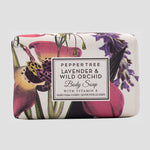 Load image into Gallery viewer, Bar of soap with floral design and label on a white background
